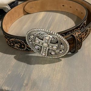 Brown cowgirl belt with oval large buckle with crystal cross. Never worn